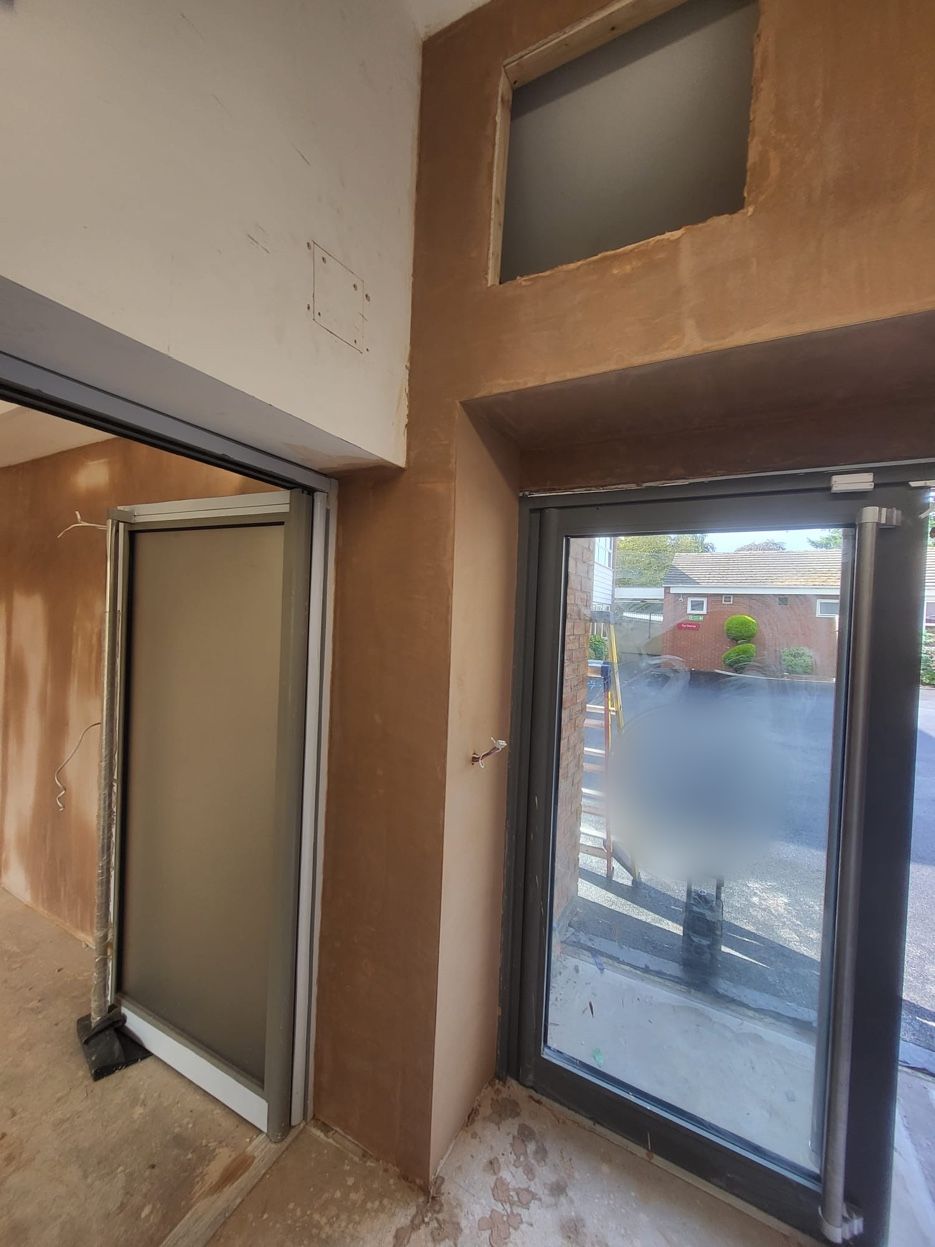 Walls around the entrance doors freshly plastered